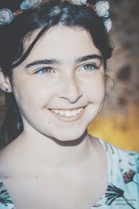 Close-up portrait of a smiling young woman