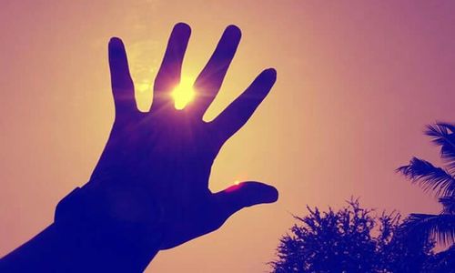 Low angle view of woman against sky