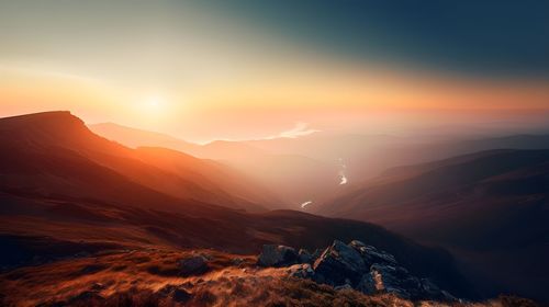 Scenic view of mountains against sky during sunset