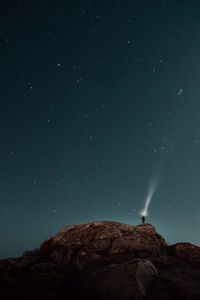 Low angle view of mountain against sky at night