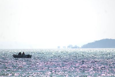 Scenic view of calm sea against clear sky