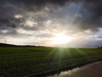 Scenic view of field against sky during sunset