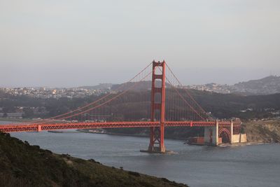 Suspension bridge over river in city