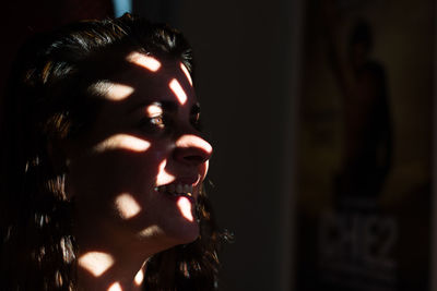 Close-up portrait of a young woman with eyes closed