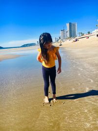 Full length of woman on beach