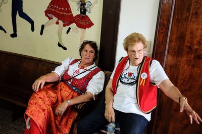 Women sitting in traditional clothing