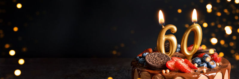 Close-up of illuminated burning candles