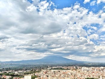 Aerial view of townscape against sky