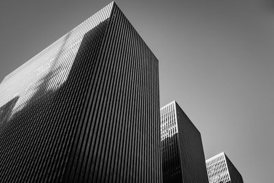 Low angle view of skyscrapers against clear sky