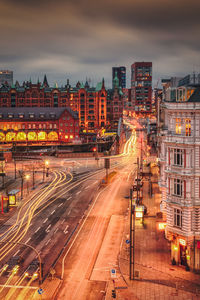 High angle view of illuminated buildings in city at night