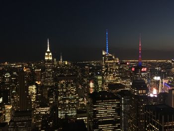 Illuminated buildings in city at night