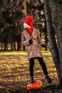 Full length of woman standing on field