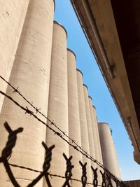 Low angle view of smoke stack against sky