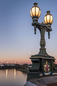 Low angle view of illuminated building against clear sky