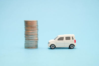 Close-up of toy car against blue background