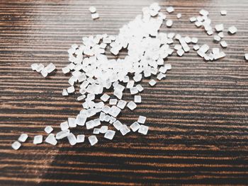 High angle view of paper stack on wooden table