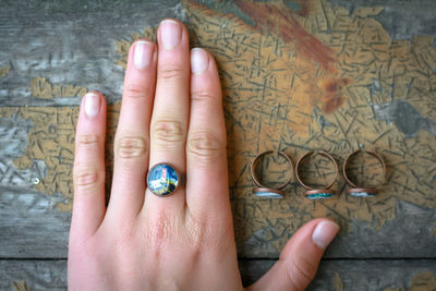 Close up woman with miniature painting in craft ring concept photo