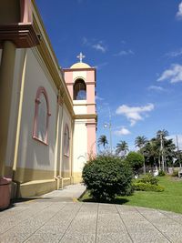 Low angle view of bell tower against sky