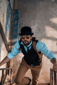 Portrait of young man wearing sunglasses standing outdoors