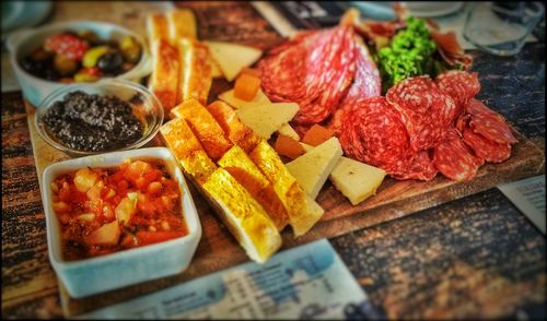 High angle view of tapas on cutting board