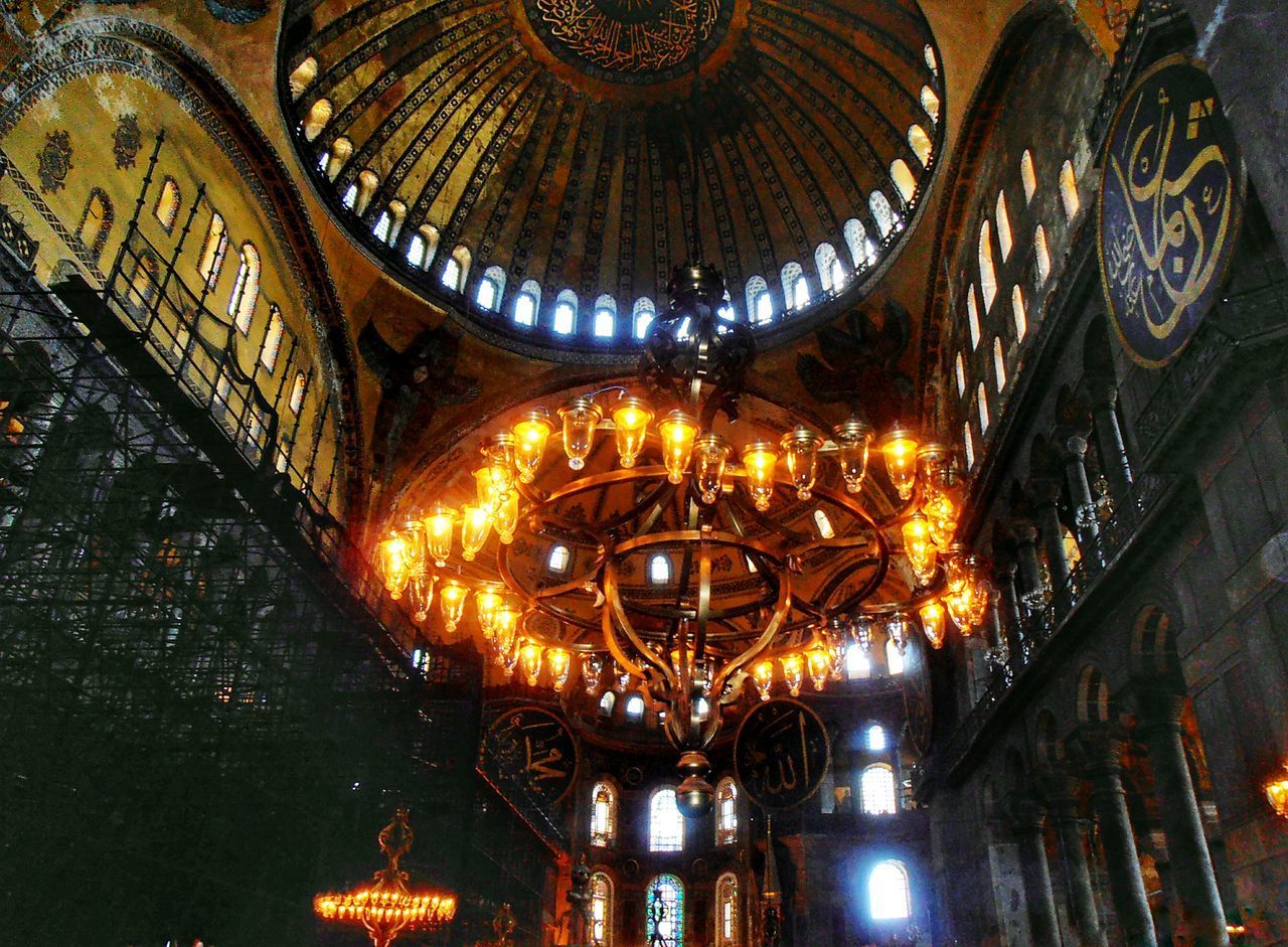 LOW ANGLE VIEW OF ILLUMINATED CEILING IN TEMPLE