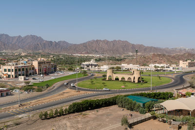 High angle view of buildings in city against clear sky