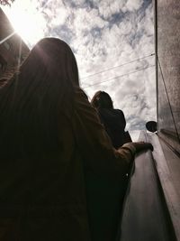 Silhouette of woman against sky