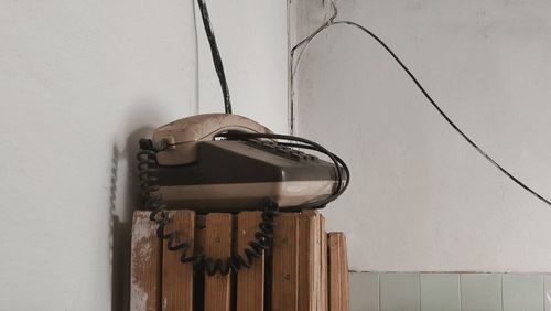 Close-up of old telephone in abandoned building
