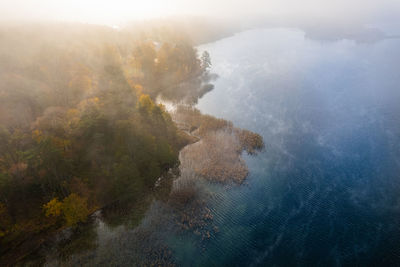 Aerial autumn fall sunrise view of trakai, galve lake, lithuania