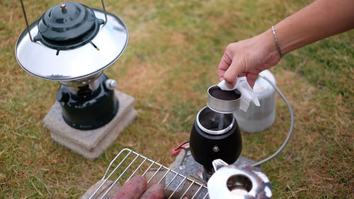 High angle view of man preparing food on field