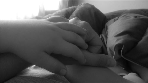 Close-up of baby sleeping on bed