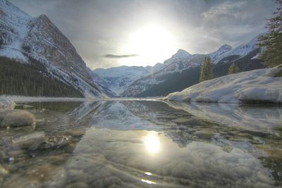 Scenic view of lake louise against sky during winter