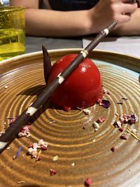 High angle view of red berries on table