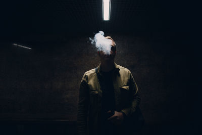 Digital composite image of man smoking cigarette