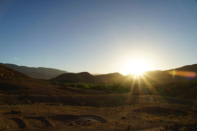 Scenic view of landscape against sky during sunset