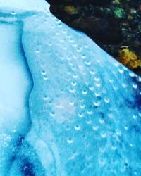 Close-up of water against blue sky