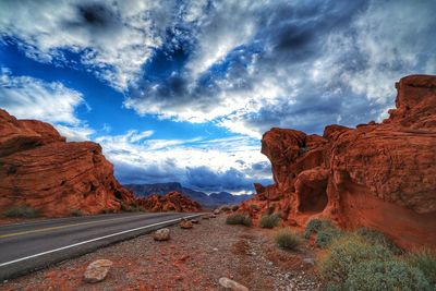 Panoramic view of road and mountains against sky