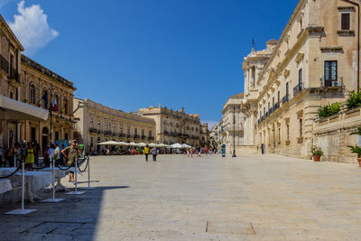 Group of people in piazza duomo in ortigia