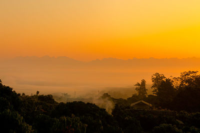 Scenic view of landscape against sky during sunset