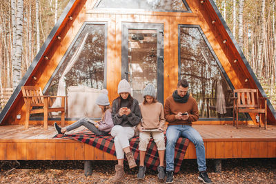 Group of people sitting outdoors