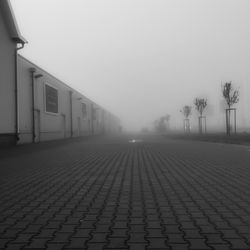 Empty road in foggy weather