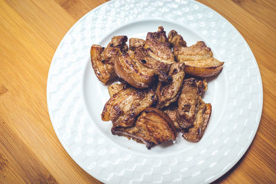 High angle view of meat in plate on table