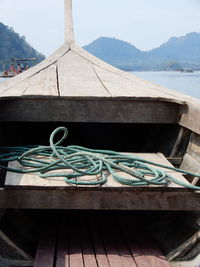 Boat on the mekong river frontier between laos and cambodia, against sky. 