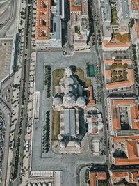 Low angle view of statue against building in city