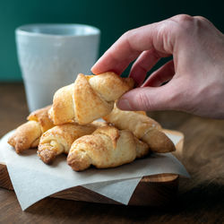 Cropped hand of person holding food