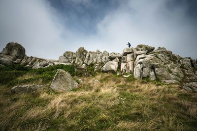 Low angle view of rock formation against sky