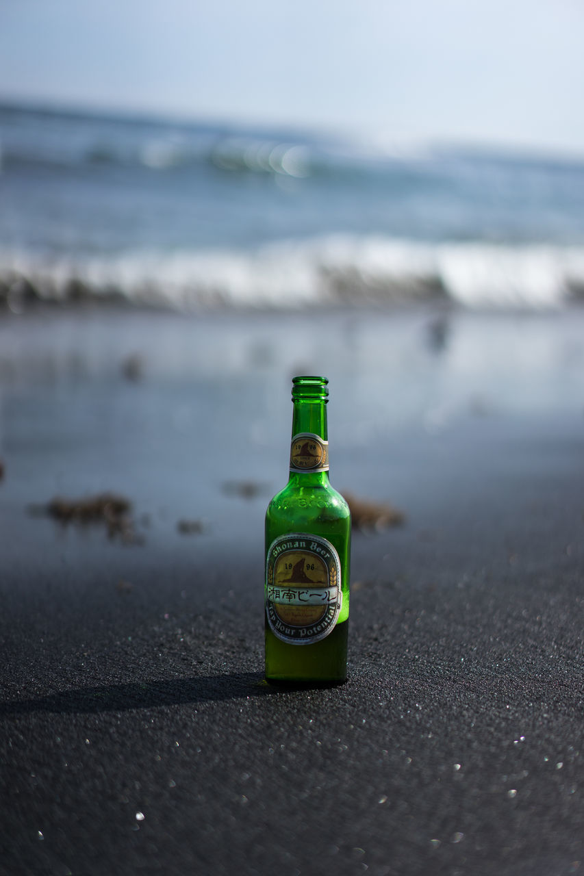 WATER BOTTLE ON SAND