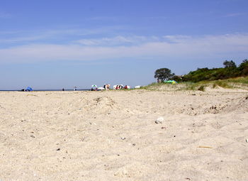 Sand at beach against sky