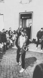 People playing guitar on street