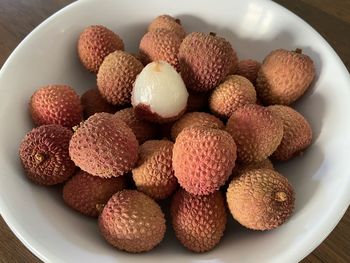 High angle view of fruits in plate on table